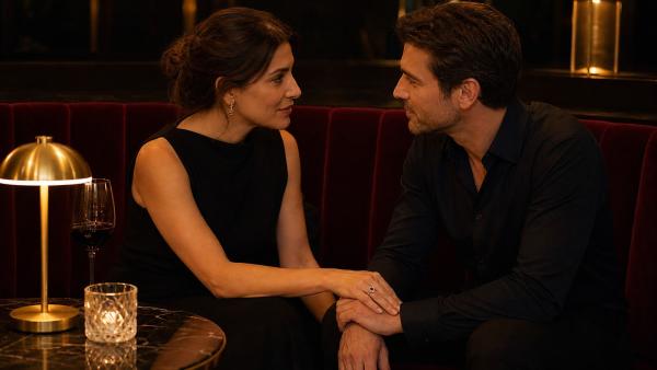 Adult couple listening to each other in an intimate and elegant setting